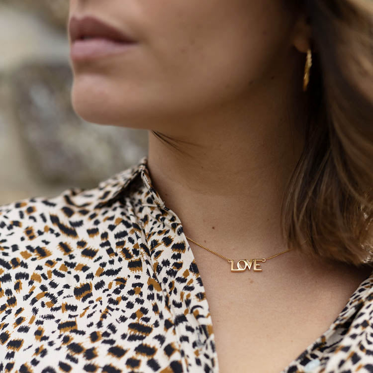 Close up shot of model wearing the Rachel Jackson Love Gold Necklace
